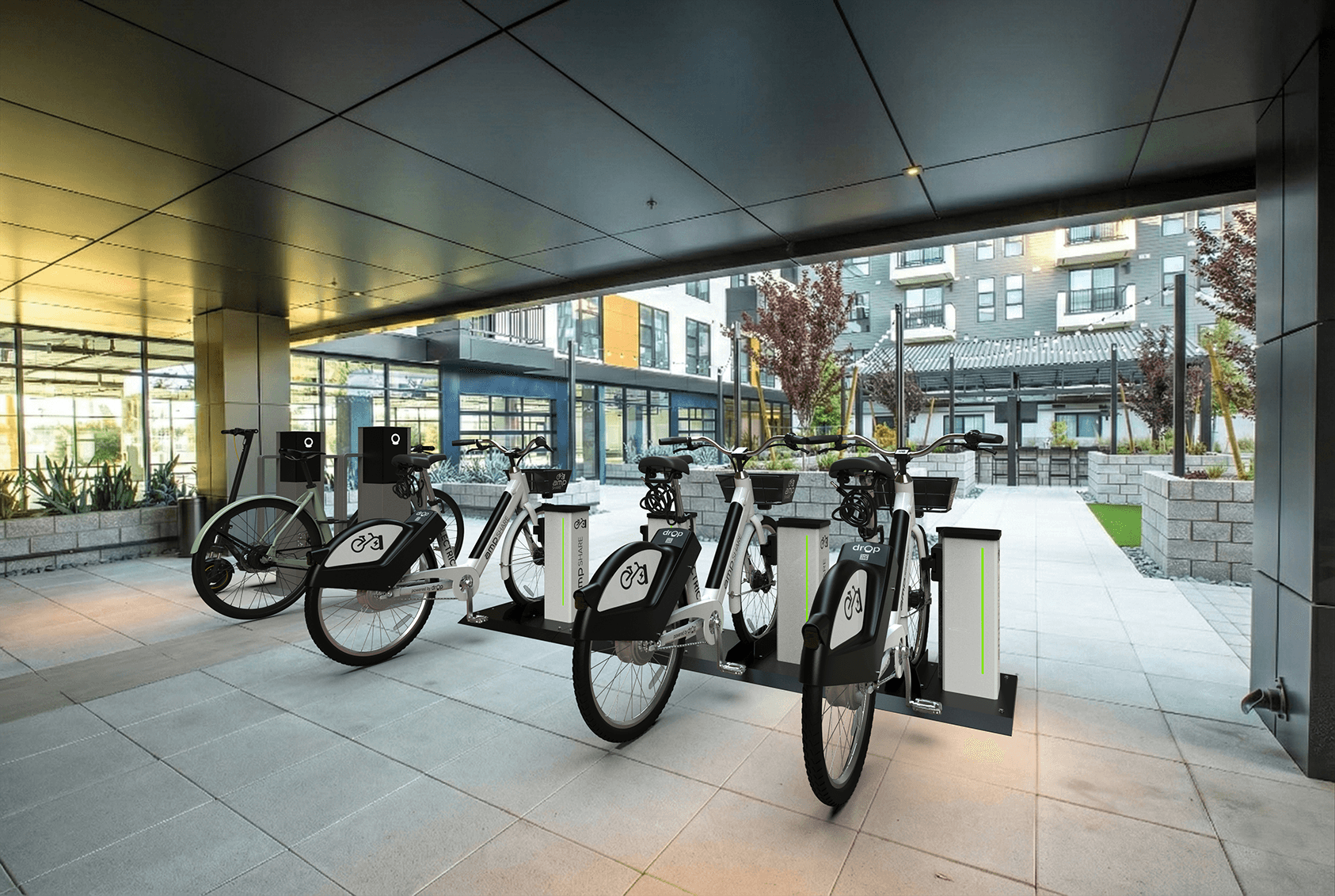 Amp e-bike charging and sharing stations installed on a campus walkway